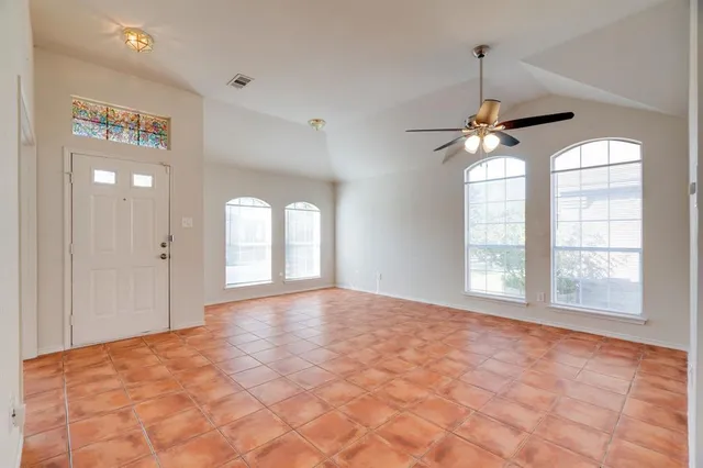 a view of an empty room with a window