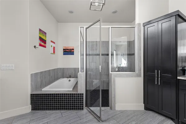 a bathroom with a shower and a sink
