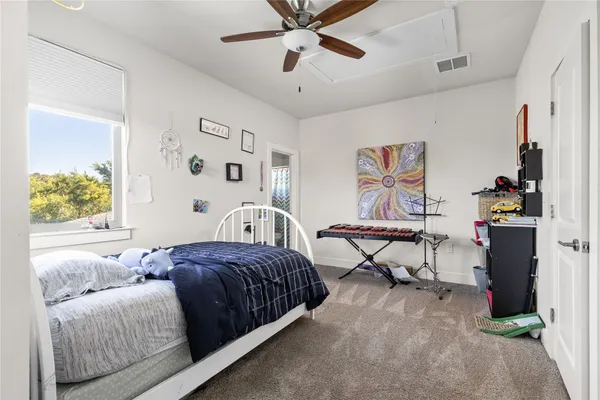 a bedroom with a bed and window