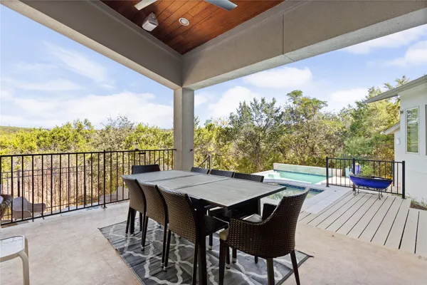 a view of a patio with a table chairs and a table