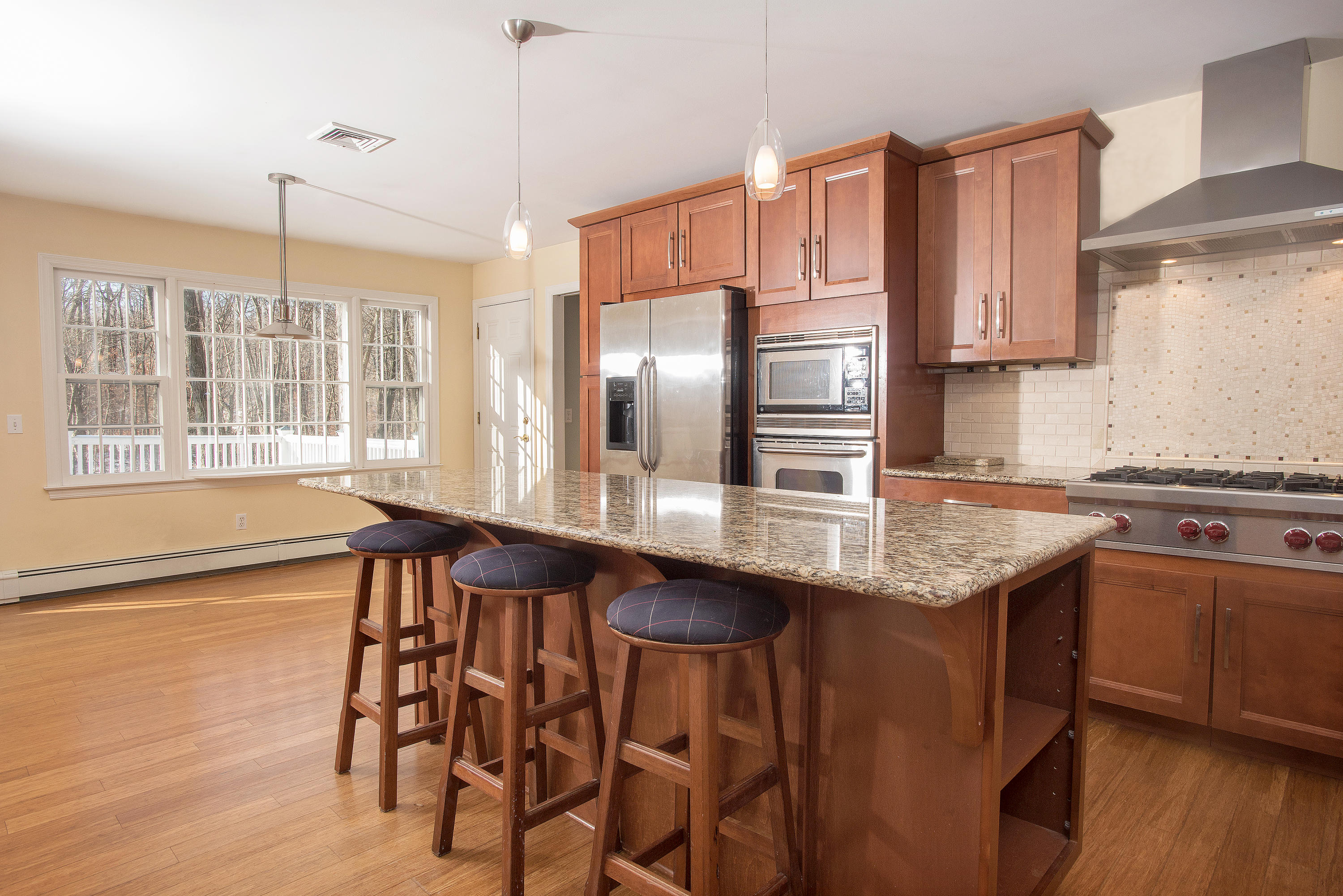 286 Indian Rock Road New Canaan, CT 06840 - Photo 8 of 24 a kitchen with counter top space and wooden floor