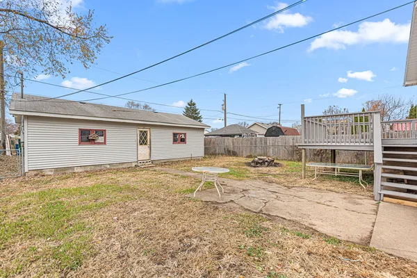 a view of a house with a backyard