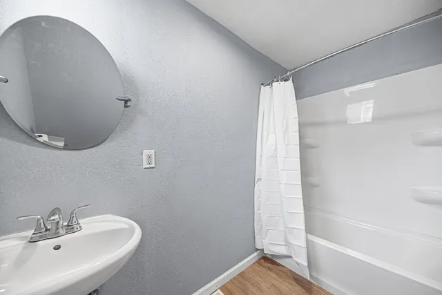 a bathroom with a sink and a mirror