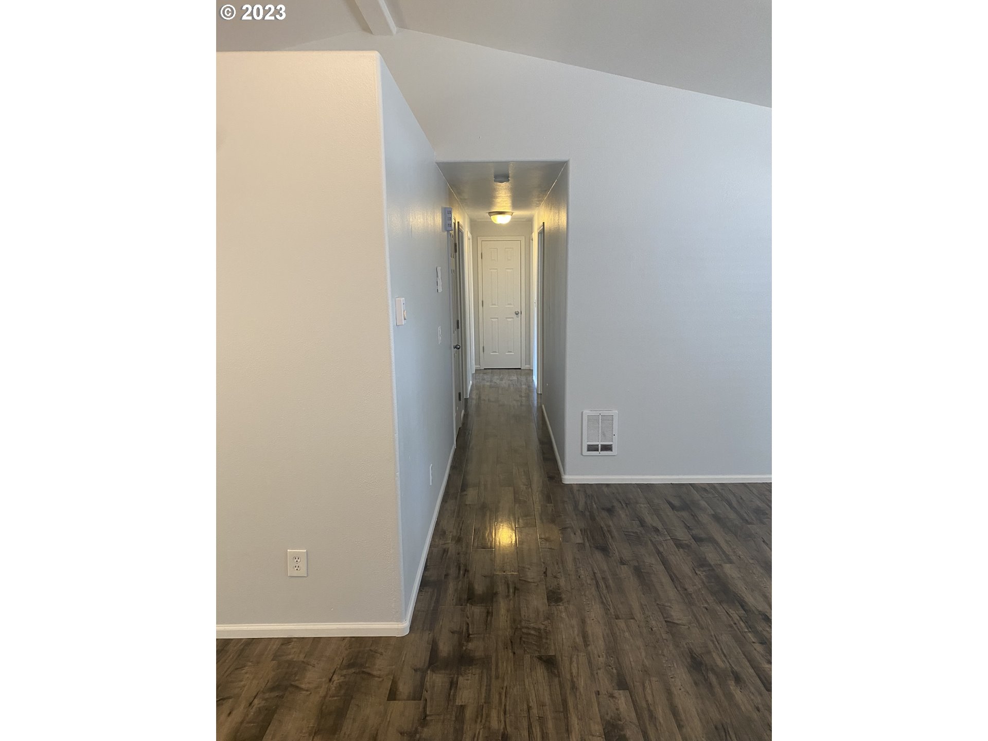 954 Aldridge Place Springfield, OR 97478 - Photo 8 of 32 a view of a hallway with wooden floor