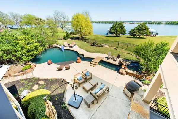an aerial view of a house with outdoor space
