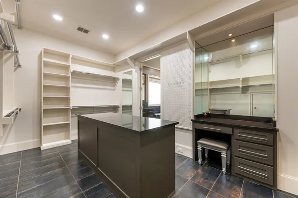 a kitchen with a sink appliances and cabinets