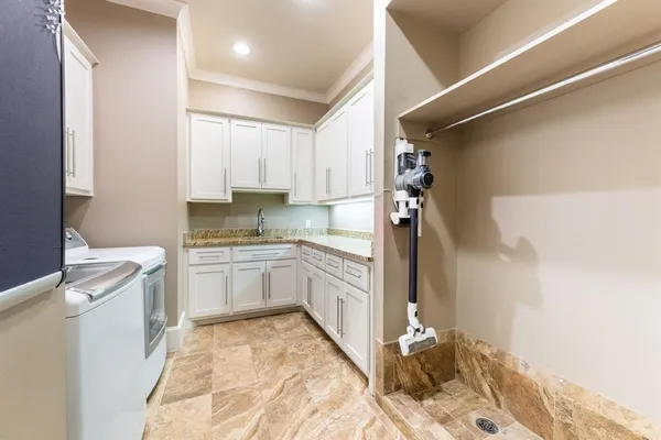 a kitchen with a cabinets and white appliances