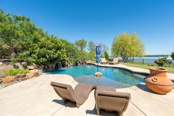 a view of swimming pool with seating space