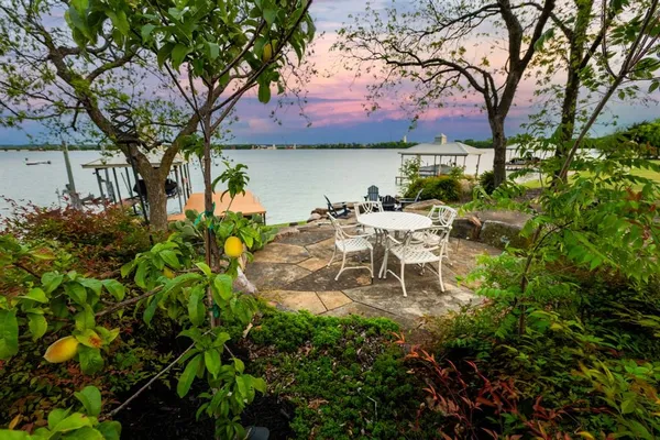 a view of a chairs and table in the garden