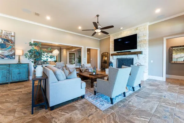 a living room with fireplace furniture and a flat screen tv