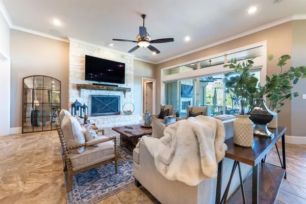 a living room with fireplace furniture and a flat screen tv
