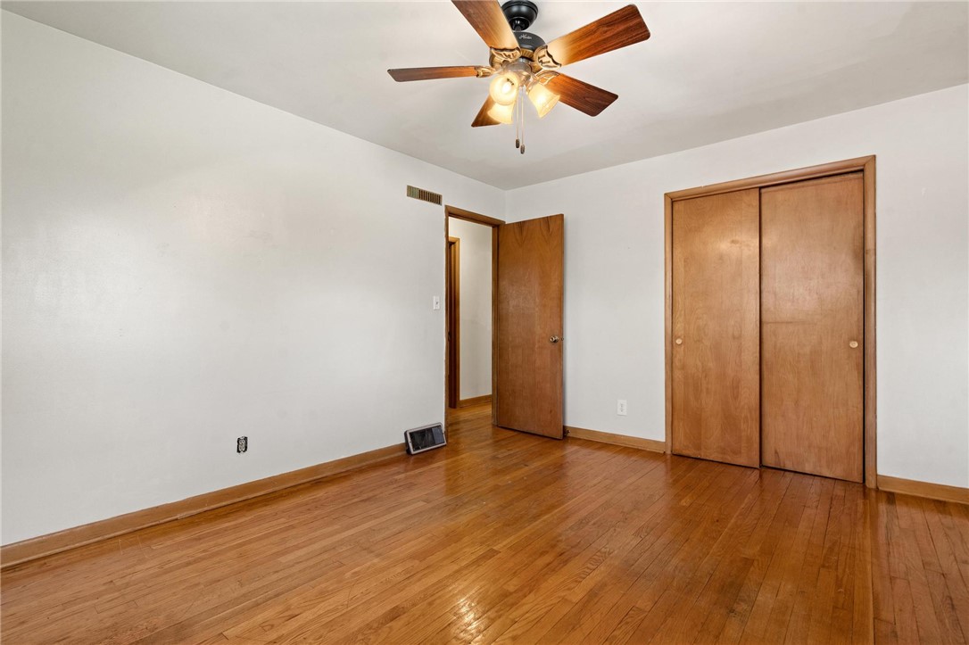 4150 Rose Marie Road Franklin, OH 45005 - Photo 33 of 36 Hardwood floors and a ceiling fan create a comfortable atmosphere in this well-appointed bedroom.