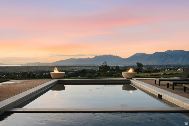 923 North Emery Lane Elk Ridge, UT 84651 - Photo 91 of 101 Outdoor pool area featuring a rectangular pool with integrated fire bowls