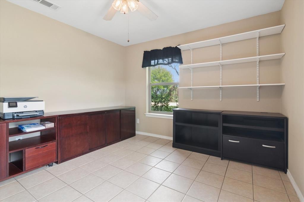 8463 Crestview Road Sanger, TX 76266 - Photo 18 of 36 Unfurnished dining area featuring a ceiling fan and light tile patterned floors