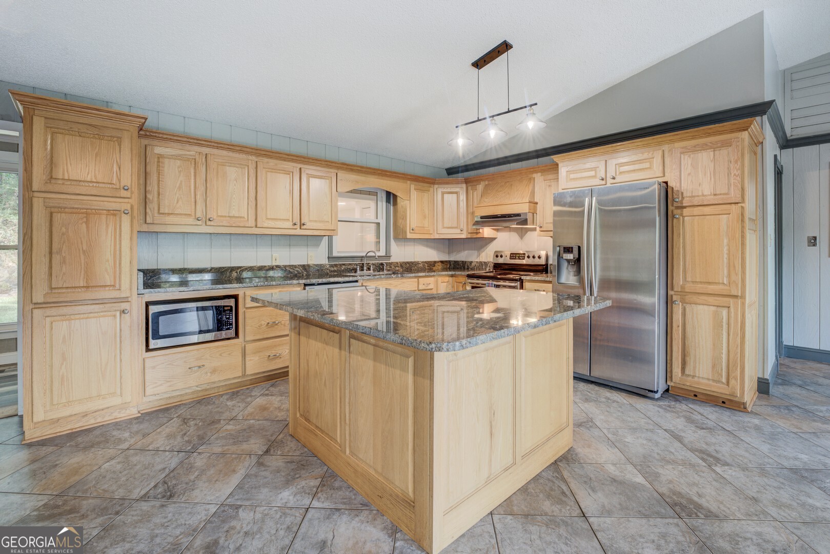 2188 Highway 36 East Jackson, GA 30233 - Photo 13 of 74 a kitchen with stainless steel appliances granite countertop a stove top oven a refrigerator a sink and dishwasher