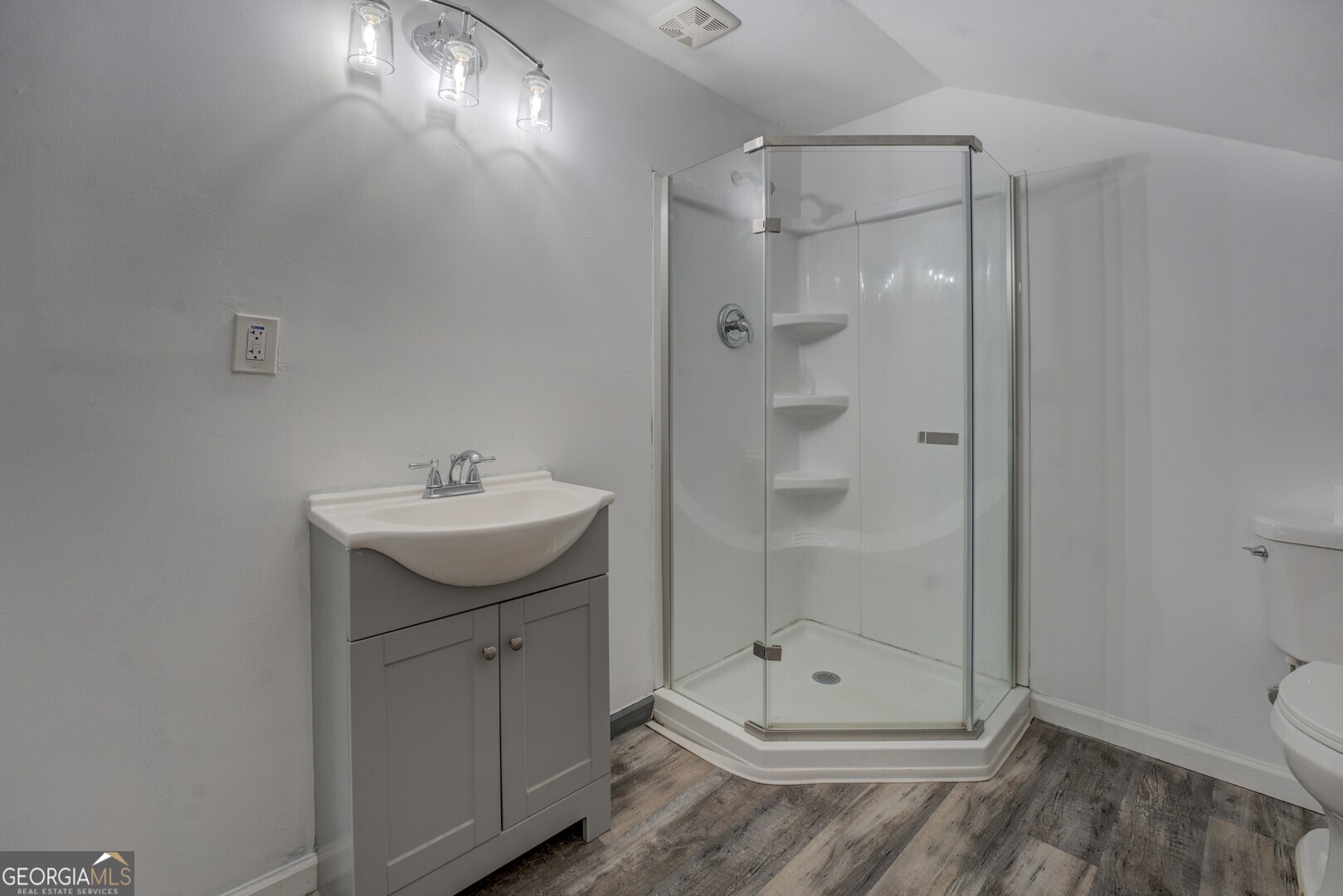 2188 Highway 36 East Jackson, GA 30233 - Photo 54 of 74 a bathroom with a shower a mirror and a sink