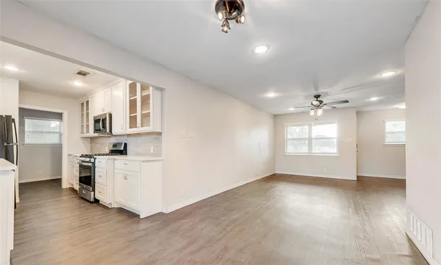a view of a kitchen with a dishwasher cabinets and a kitchen