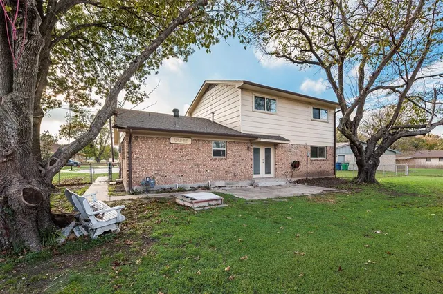 a front view of house with yard and seating area