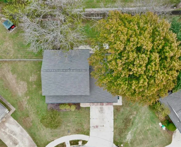 a aerial view of a house with a yard