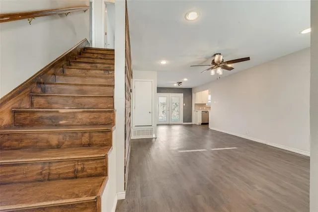 a view of an entryway with wooden floor