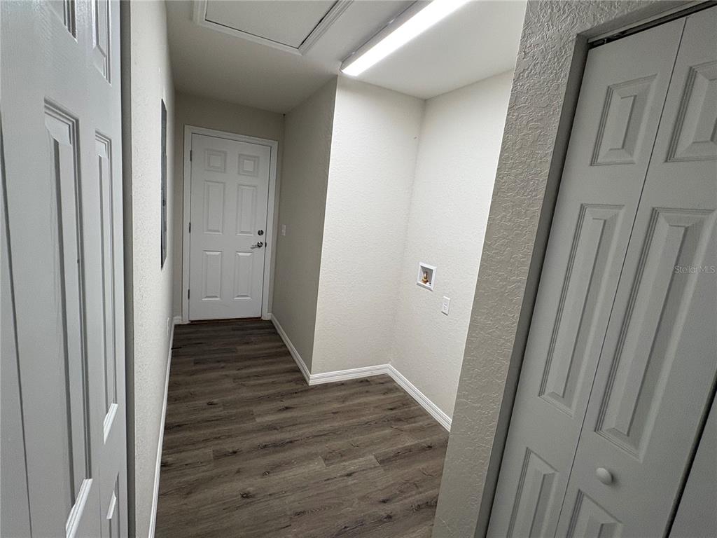 9650 Northwest Gainesville Road Ocala, FL 34482 - Photo 17 of 32 a view of a hallway with wooden floor