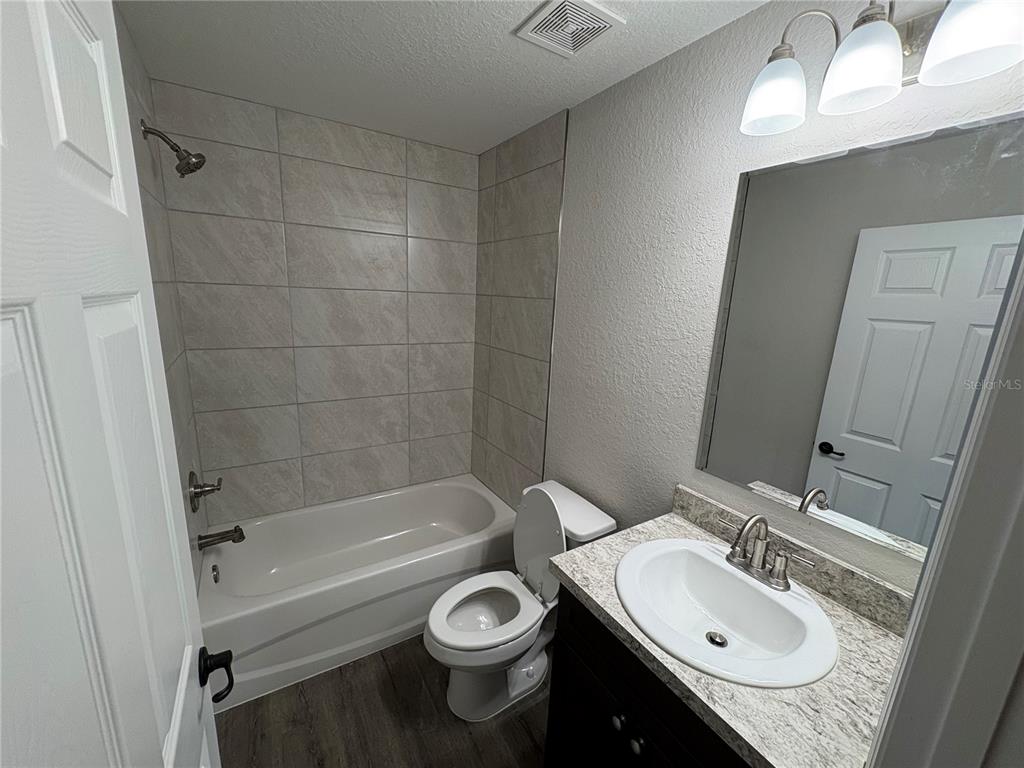 9650 Northwest Gainesville Road Ocala, FL 34482 - Photo 22 of 32 a bathroom with a sink a toilet and shower