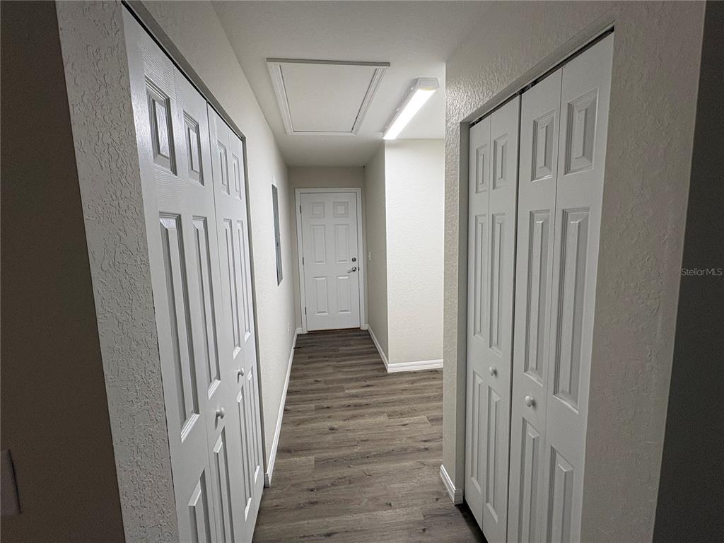 9650 Northwest Gainesville Road Ocala, FL 34482 - Photo 23 of 32 a view of a hallway with wooden floor