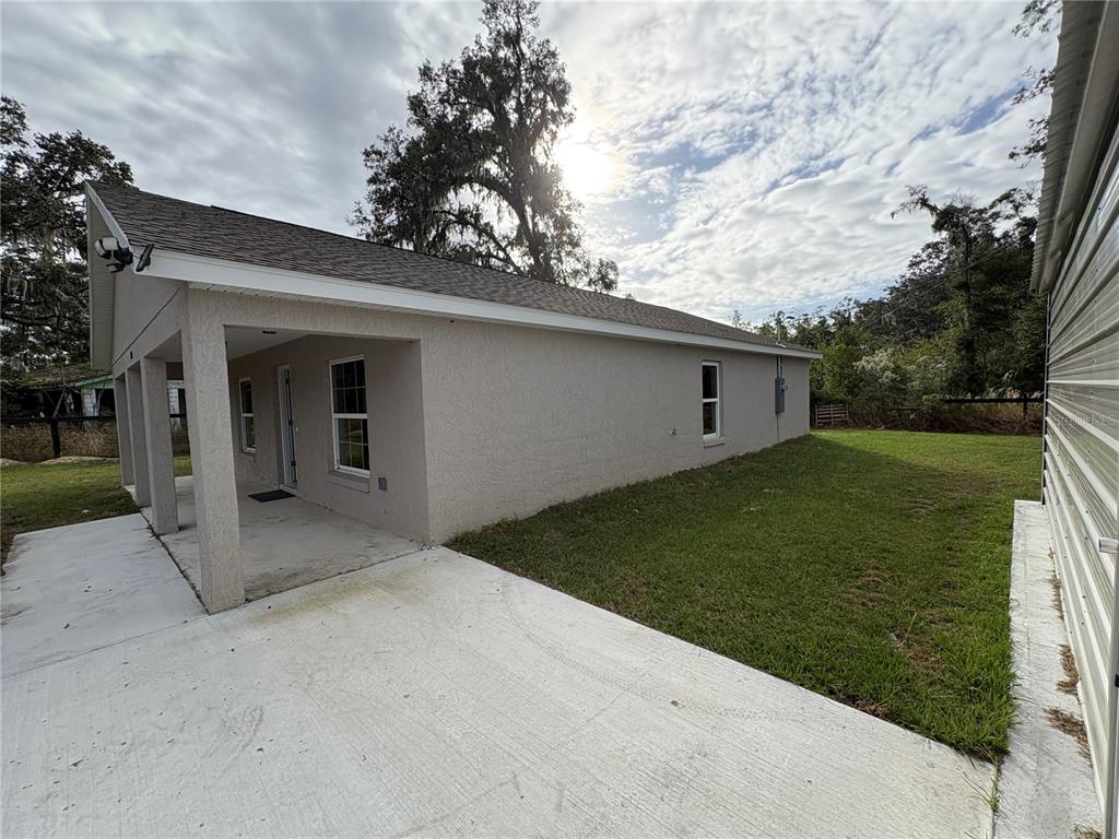 9650 Northwest Gainesville Road Ocala, FL 34482 - Photo 26 of 32 a view of a house with a backyard