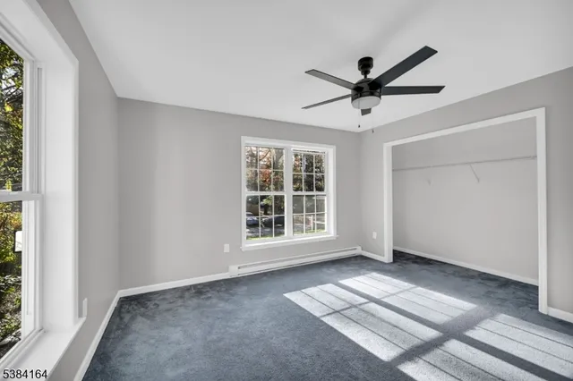 a view of workspace with window and a ceiling fan