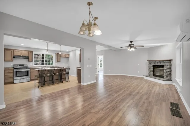 an open kitchen with a table and chairs