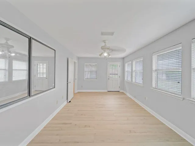 a view of an empty room with a window