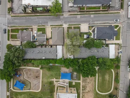 an aerial view of a house with outdoor space and a lake view