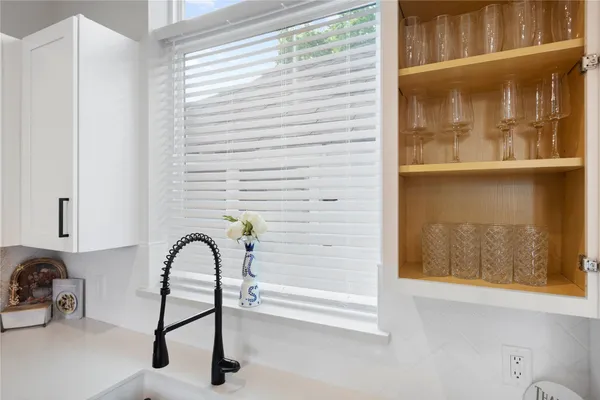 a view of a brick house with a large window