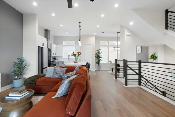 a living room with furniture and a potted plant