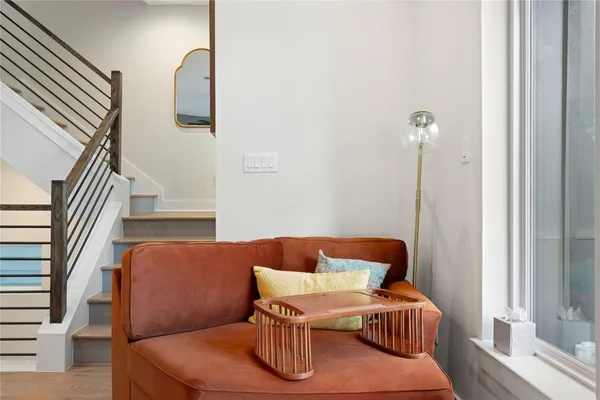 a bedroom with furniture and a view of kitchen