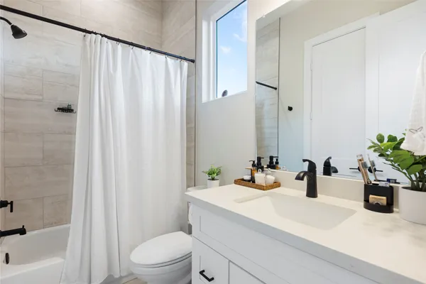 a bedroom with a bed and a lamp