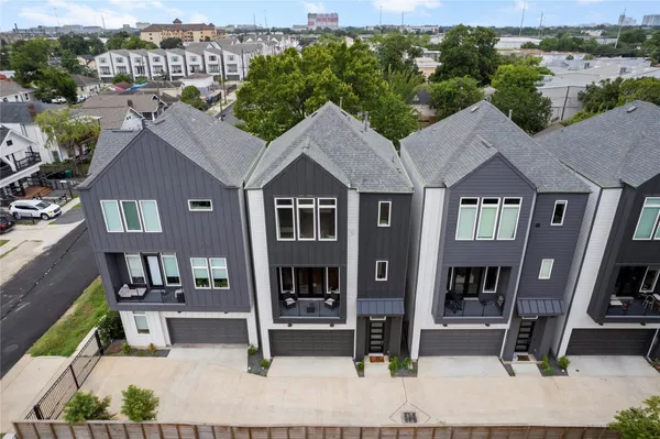 a bathroom with a sink a toilet and shower curtain