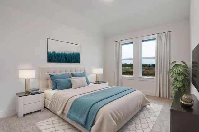 a bedroom with a bed and a large window