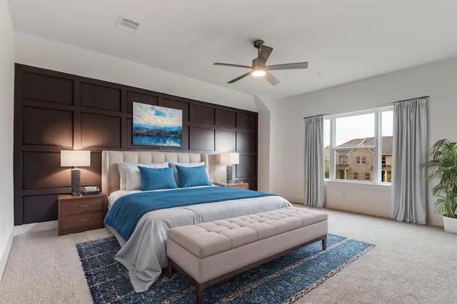 a spacious bedroom with a large bed and a window