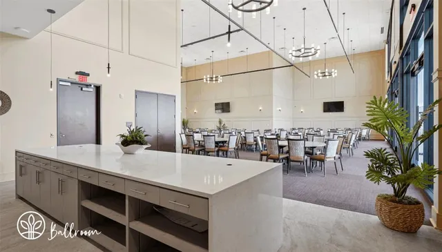 a room with gym equipment and a potted plant