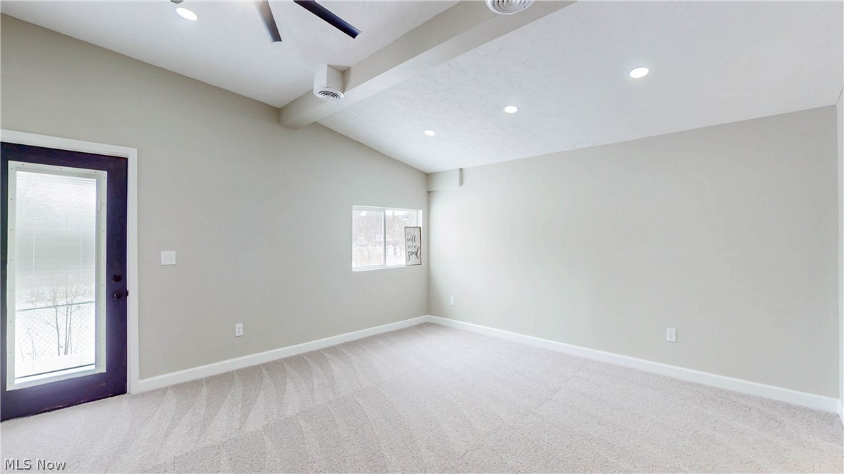 3312 Bancroft Road Akron, OH 44333 - Photo 17 of 50 Spare room featuring vaulted ceiling with beams, light carpet, recessed lighting, and ceiling fan