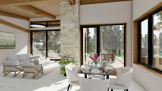 a living room with furniture and floor to ceiling windows