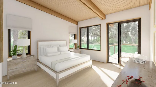 a bedroom with a large bed and a large window with outer view