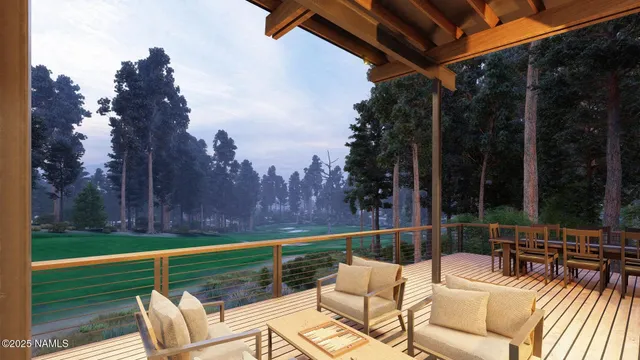 a view of a chairs and table in patio with a yard