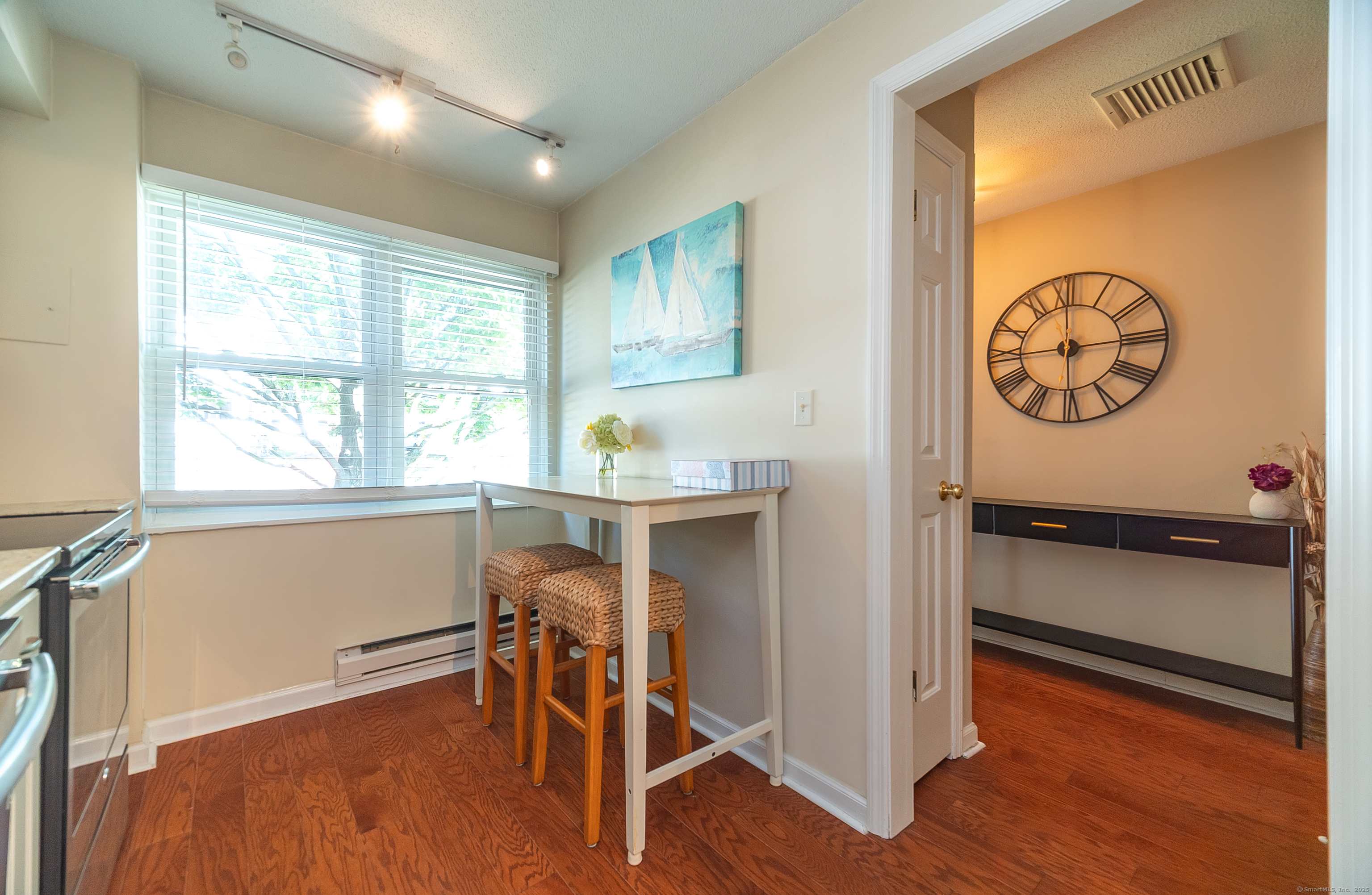109 Highland Road, Unit 109 Stamford, CT 06901 - Photo 19 of 37 a view of a room with wooden floor and a window