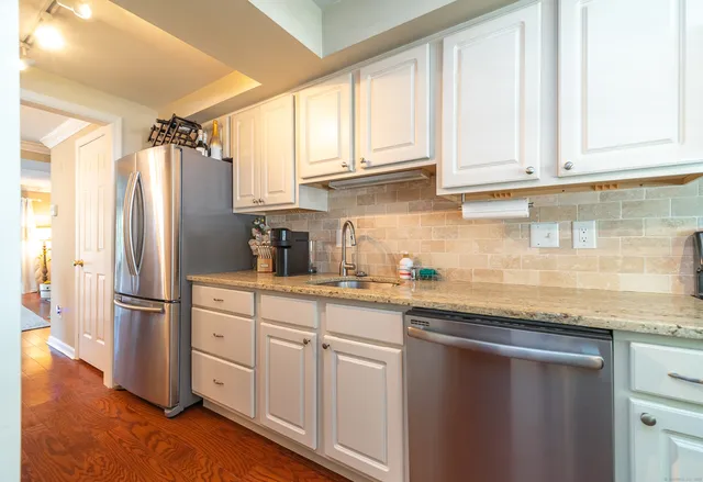a kitchen with appliances cabinets and a counter top space