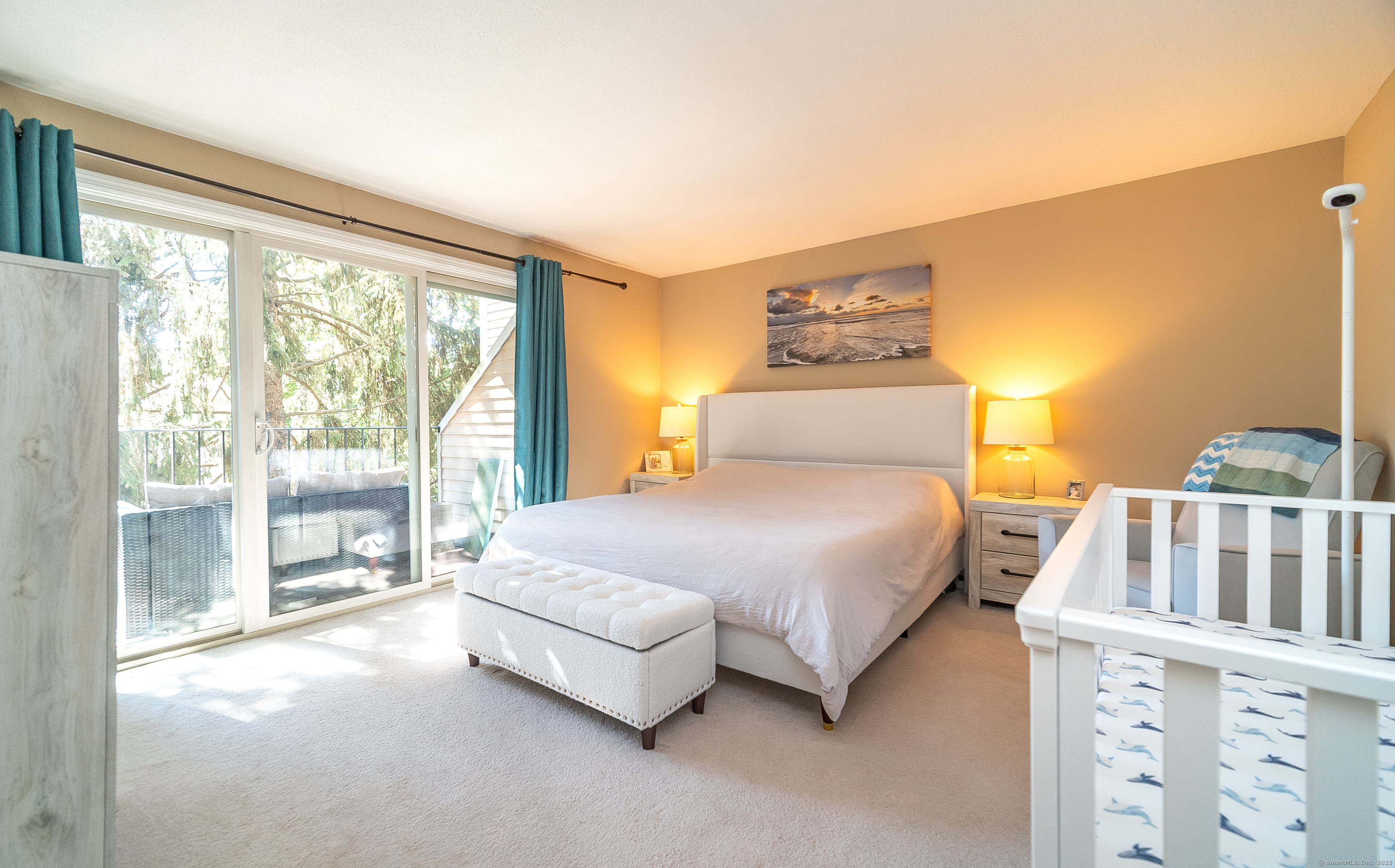 109 Highland Road, Unit 109 Stamford, CT 06901 - Photo 32 of 37 a spacious bedroom with a bed and a large window