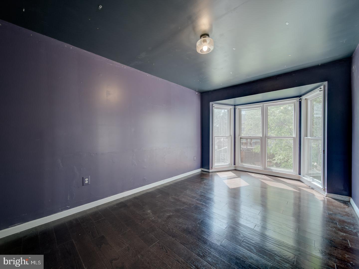 9618 Clover Hill Road Manassas, VA 20110 - Photo 22 of 61 a view of an empty room with wooden floor and a window