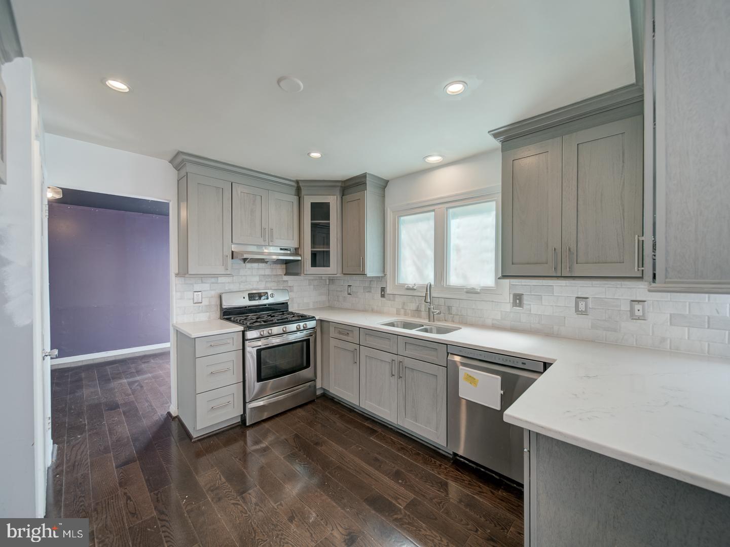 9618 Clover Hill Road Manassas, VA 20110 - Photo 26 of 61 a kitchen with a sink stove and cabinets
