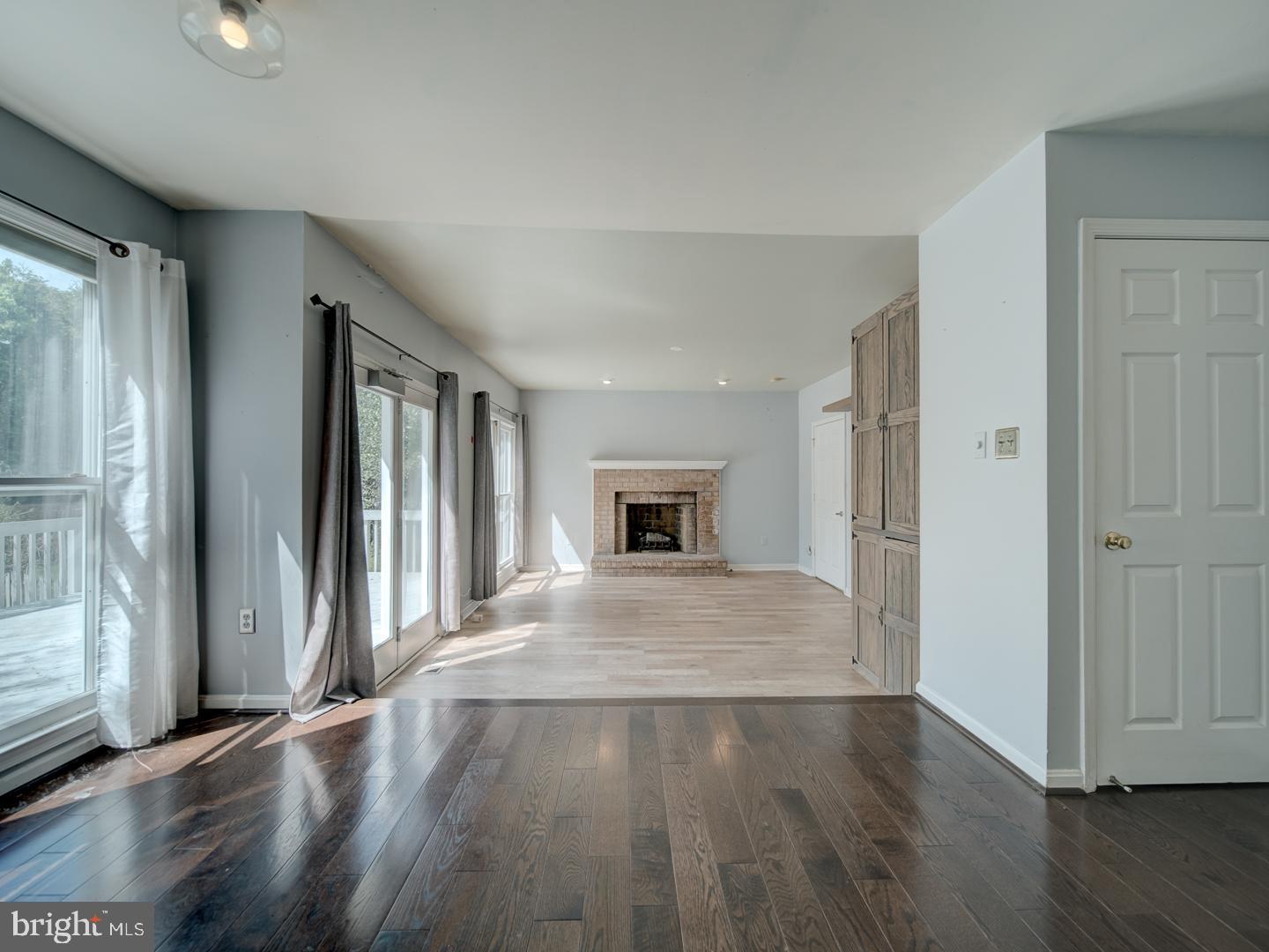 9618 Clover Hill Road Manassas, VA 20110 - Photo 30 of 61 an empty room with wooden floor and windows